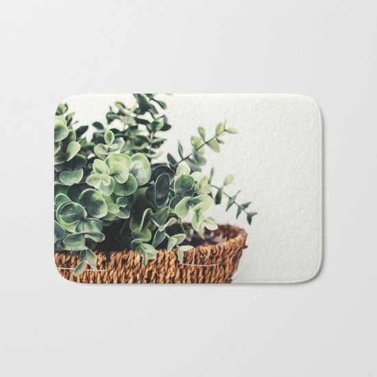 Plant On White Bath Mat