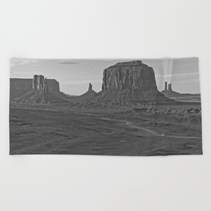 Oljato Monument Valley, Arizona, natural rock formations under blue sky black and white landscape photograph / photography Beach Towel