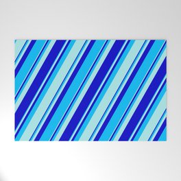 [ Thumbnail: Turquoise, Blue, and Deep Sky Blue Colored Pattern of Stripes Welcome Mat ]