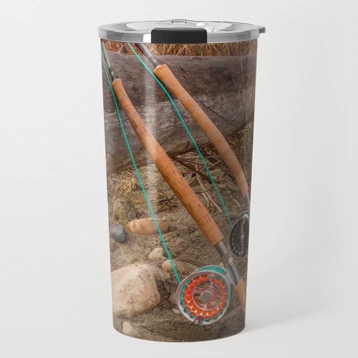 Two salmon spey fly rods resting on a log in the late afternoon sun, in British Columbia, Canada Travel Mug