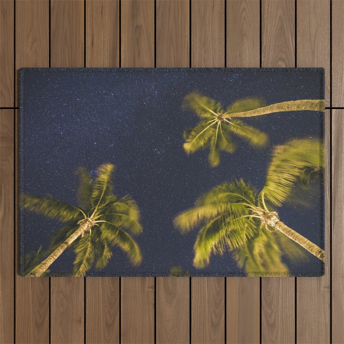 Palm trees at night against starry sky Outdoor Rug