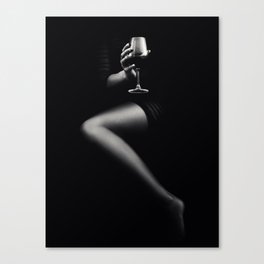 Woman holding red wine Canvas Print