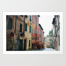 Photo of pastel colored houses with laundry in Siena, Tuscany, Italy I | Fine Art Colorful Travel Photography |  Art Print
