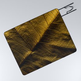Close-up view on golden leaf from Bodhi tree. Concept of luxury to decorate. Gold-plated leaves deluxe natural illustration design. Picnic Blanket