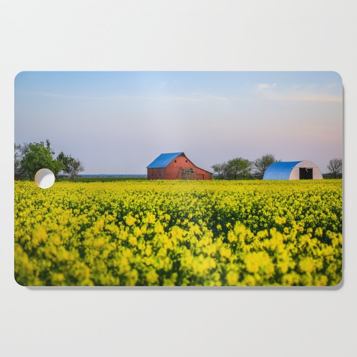 The Farm - Red Barn in Yellow Canola Field at Dusk on Spring Evening in Oklahoma Cutting Board