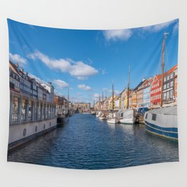 Nyhavn Canal under a blue sky with some clouds Wall Tapestry