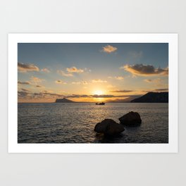 Mediterranean sunset. Golden sunlight, clouds and the sea Art Print