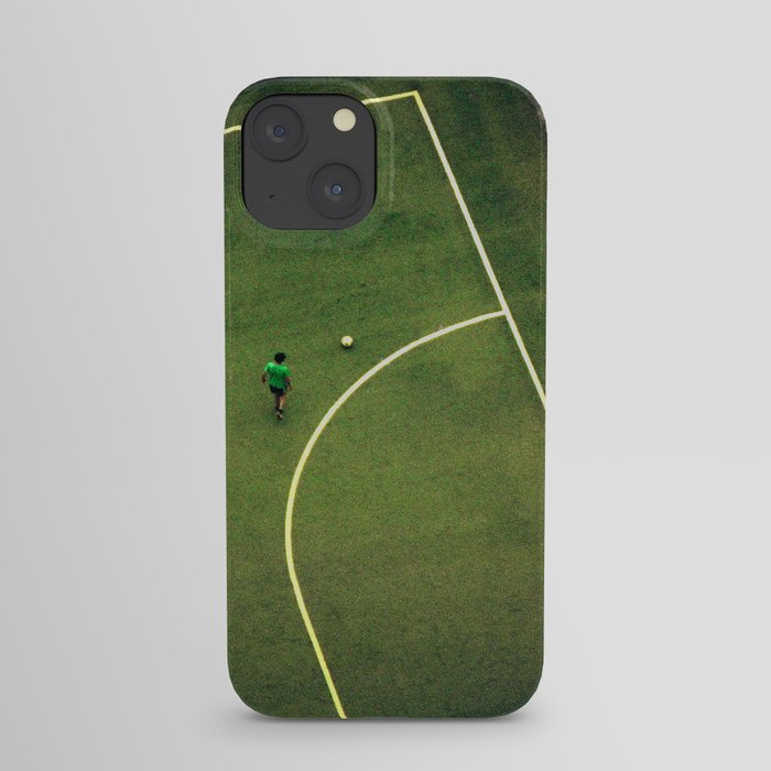 Kids are playing football on the green field iPhone Case