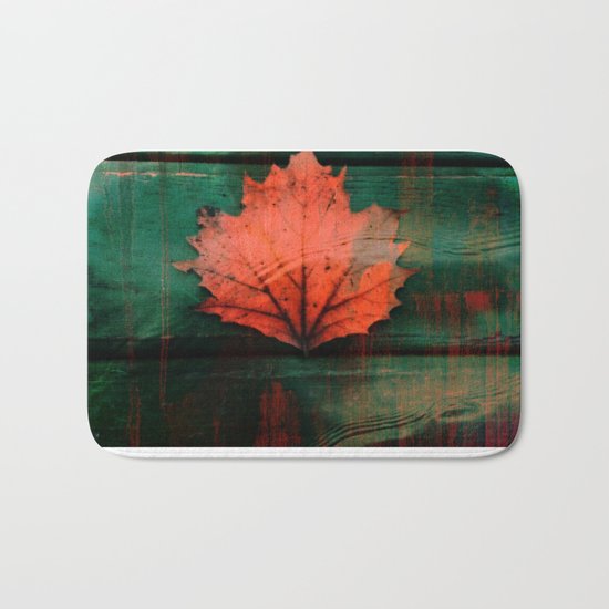 Rusty red dried fall leaf on wooden hunter green beams Bath Mat