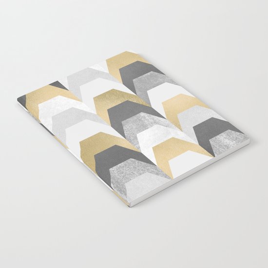 Stacks of Gold and Grey Notebook