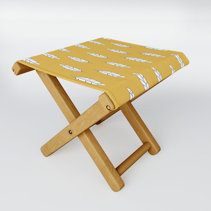 White feathers on a mustard background. Folding Stool