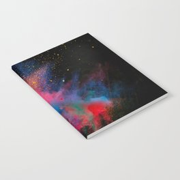 Launched colorful powder on black background Notebook