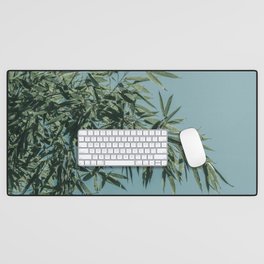 muted green and blue sky bamboo branches Desk Mat