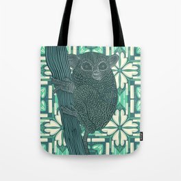Bush baby sitting on tree stump with light green pattern background Tote Bag