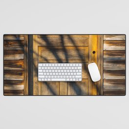 Shadows of Branches over Golden Wooden Door Mysterious Portal Desk Mat