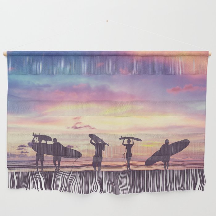 Silhouette Of surfer people carrying their surfboard on sunset beach, vintage filter effect with soft style Wall Hanging