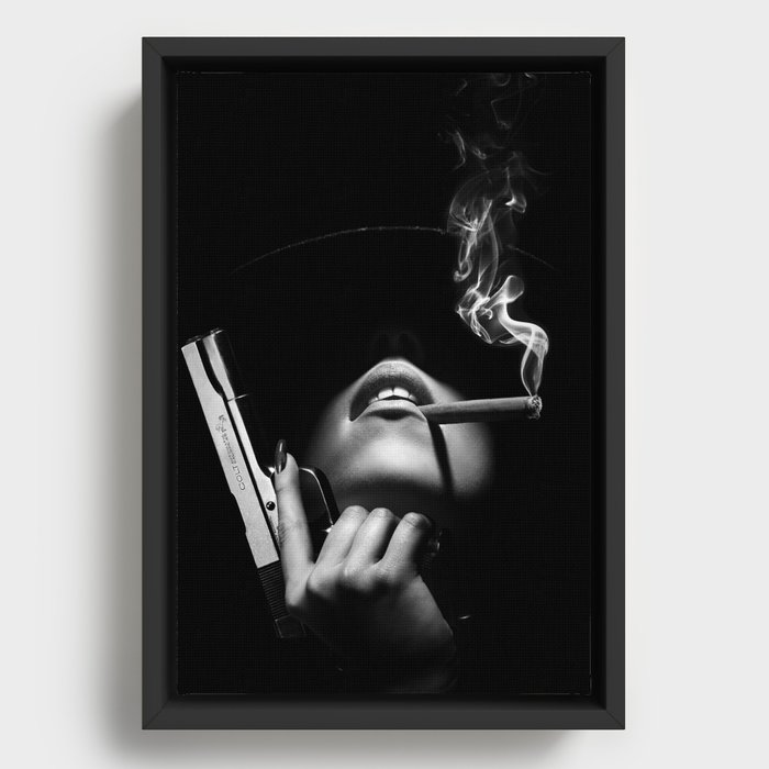 Woman with handgun Framed Canvas