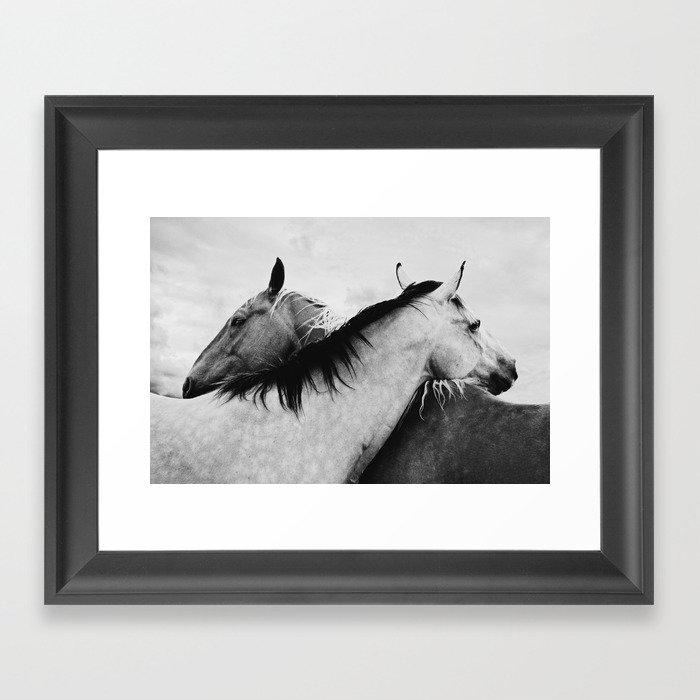 Hugging horses Framed Art Print