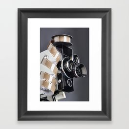 Retro mechanical movie camera and reel film Framed Art Print