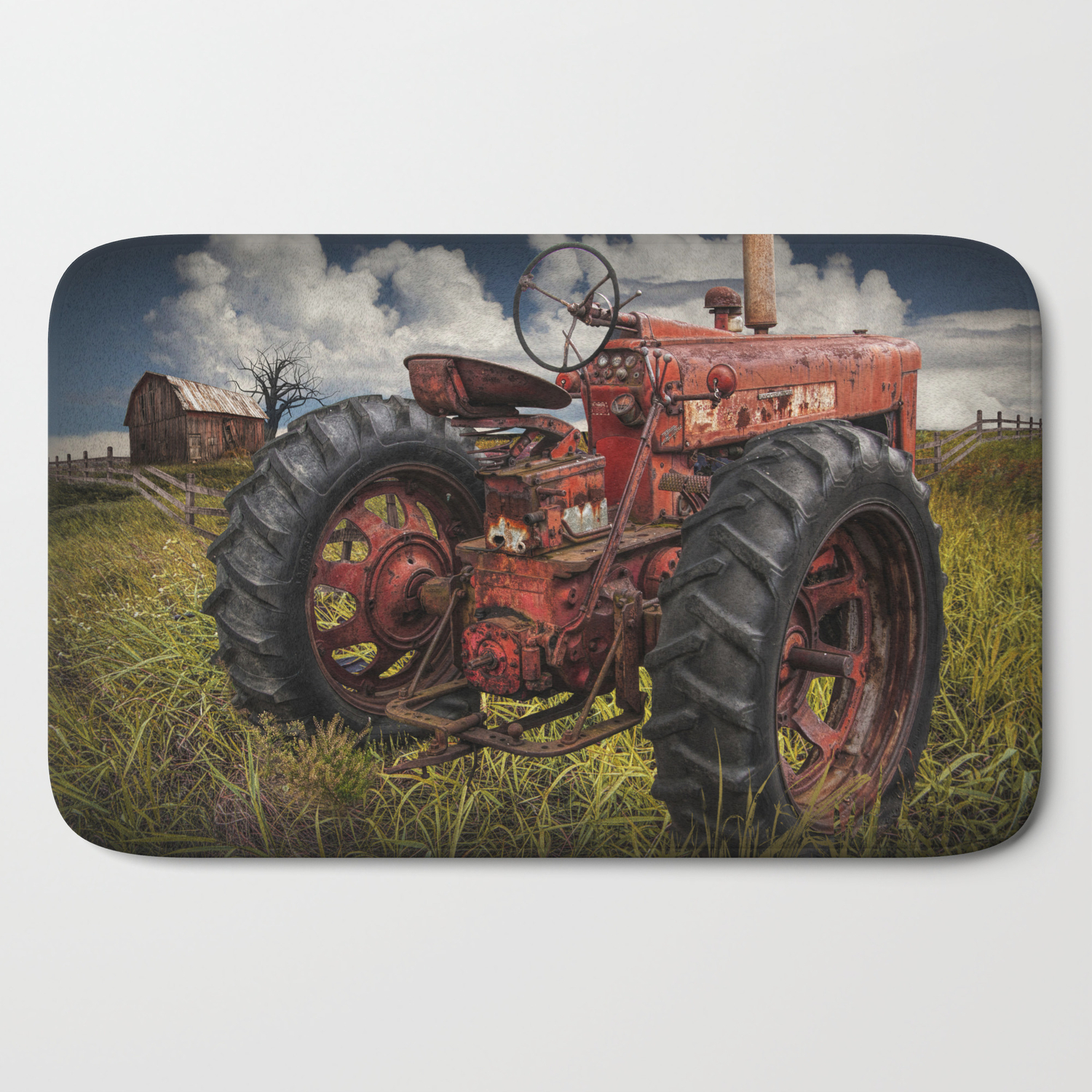 Abandoned Old Farmall Tractor In A Grassy Field On A Farm Bath Mat