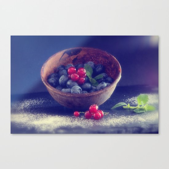 Dark blue berries contrasting with bright red berries Canvas Print