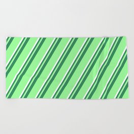 [ Thumbnail: Sea Green, Green, and White Colored Pattern of Stripes Beach Towel ]