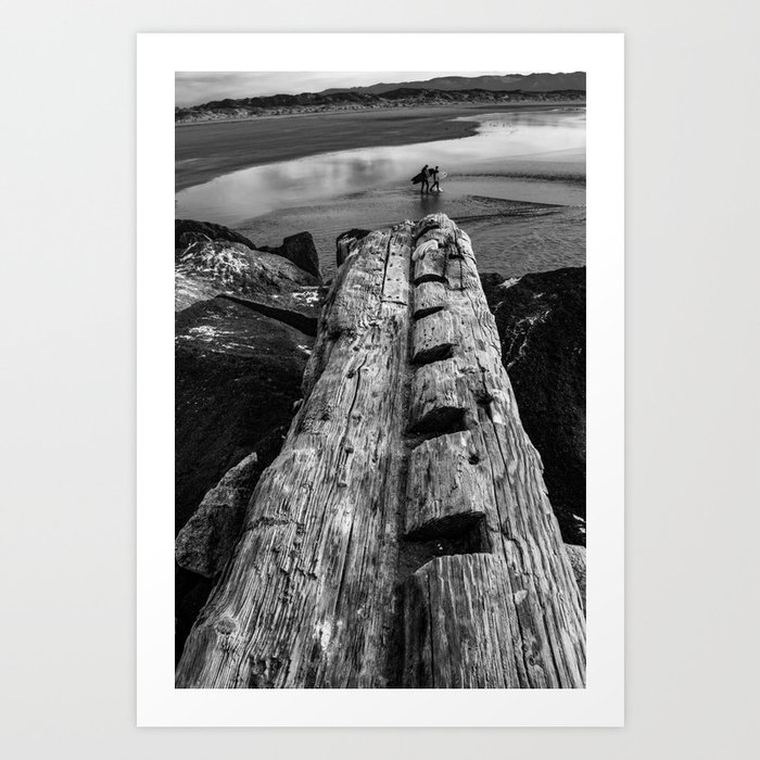 Surfers and Driftwood Art Print