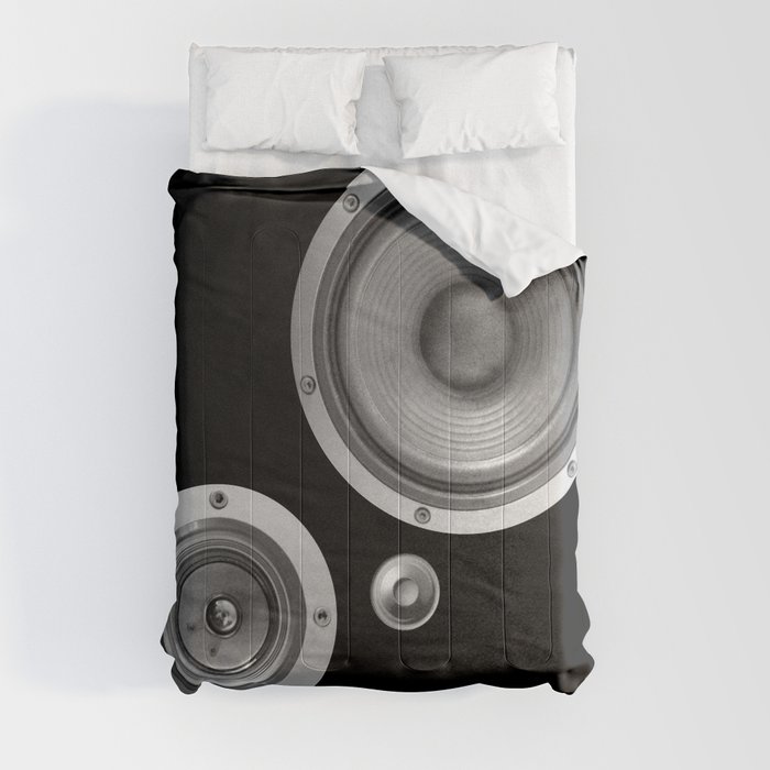 Subwoofer Speaker on black Comforter