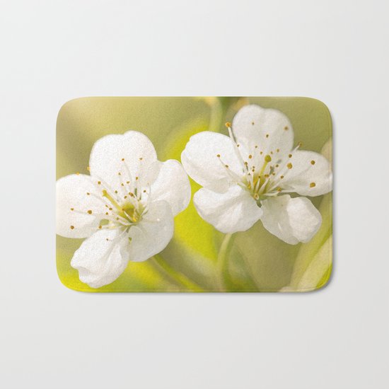 Beautiful cherry blossom on a vivid green background - summer atmosphere Bath Mat