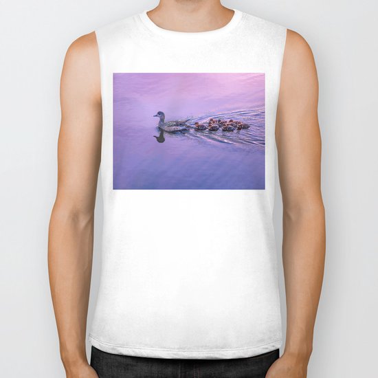 Ducklings floating at sunset Biker Tank