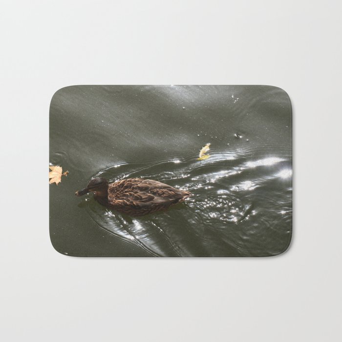 Duck swimming in a lake Bath Mat
