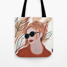 Girl with sunglasses on tan leafy background Tote Bag