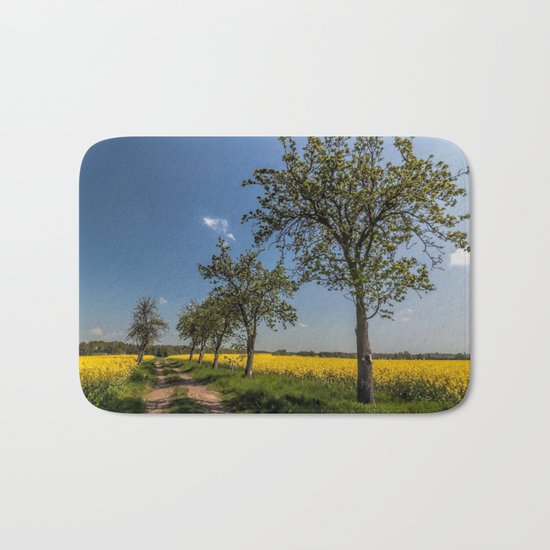 Spring landscape- a trail in the rapeseed Bath Mat