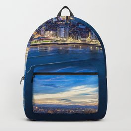 City lights during sunset in Gijon, Asturias, Spain Backpack