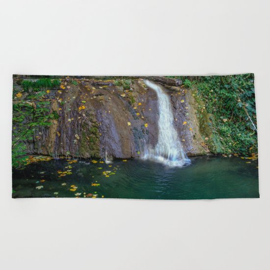 Autumn leaves in the waterfall Beach Towel