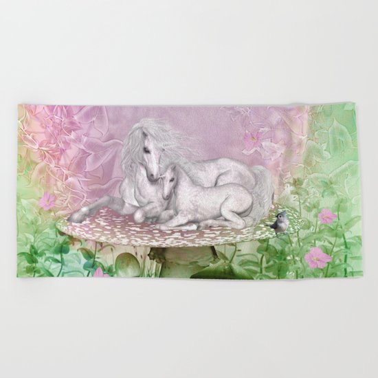 Wonderful unicorn with foal Beach Towel