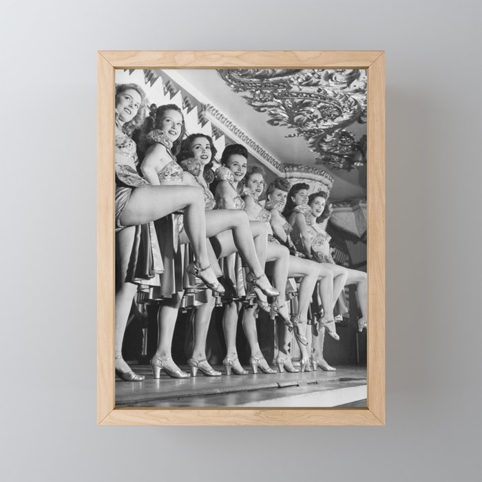 Chorus line of women with legs lifted Framed Mini Art Print