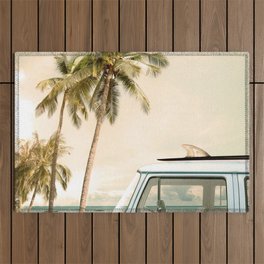 Vintage car parked on the tropical beach (seaside) with a surfboard on the roof Outdoor Rug