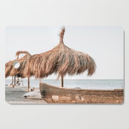 Umbrellas, Boat and Sandy Beach Tranquility, Sea Landscape, Summer Vibes, Ocean Relaxation Cutting Board