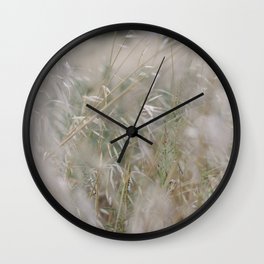 Tall wild grass growing in a meadow Wall Clock