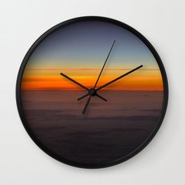 Sunrise over clouds Wall Clock