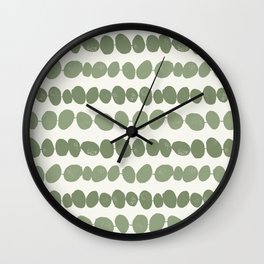 Pebbles - green pebbles on a string with a cream background Wall Clock