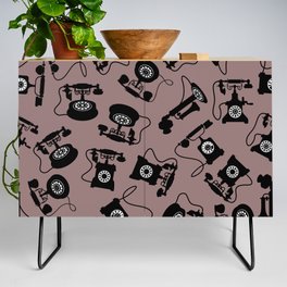 Black Vintage Rotary Dial Telephone Pattern on Rosy Brown Credenza