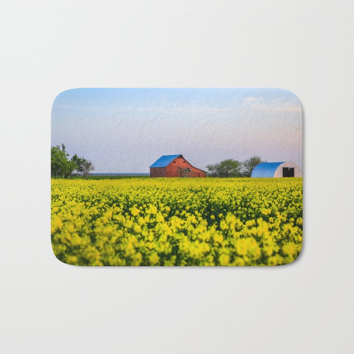 The Farm - Red Barn in Yellow Canola Field at Dusk on Spring Evening in Oklahoma Bath Mat