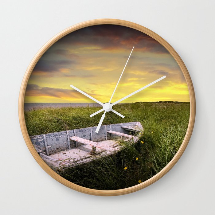 Stranded Row Boat in the Beach Grass at Sunrise on the shore on Prince Edward Island Wall Clock