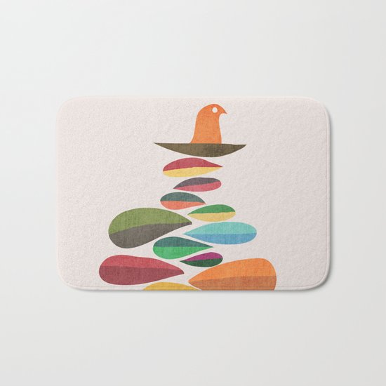 Bird nesting on top of pebbles hill Bath Mat