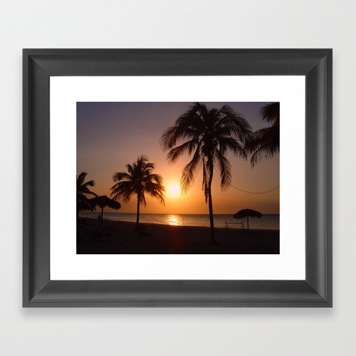 Palm trees at sunset Framed Art Print