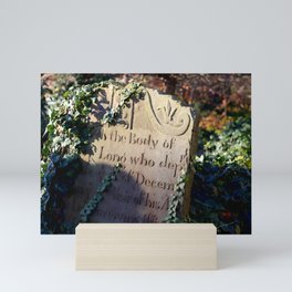 gravestone in morning light Mini Art Print