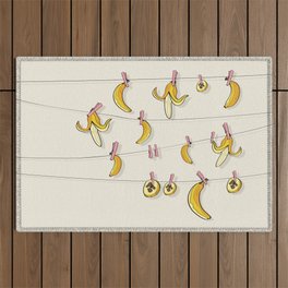 Bananas on clothespins Outdoor Rug