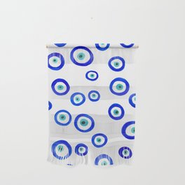 Scattered Evil Eyes on White Wall Hanging